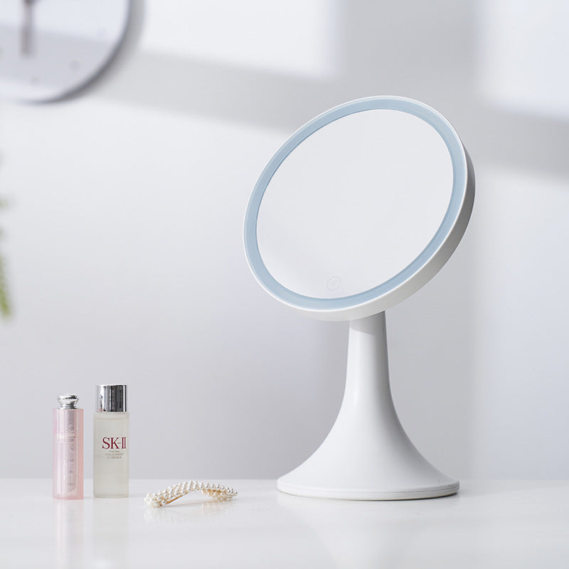 Woman using Noir Glow LED makeup mirror for beauty routine